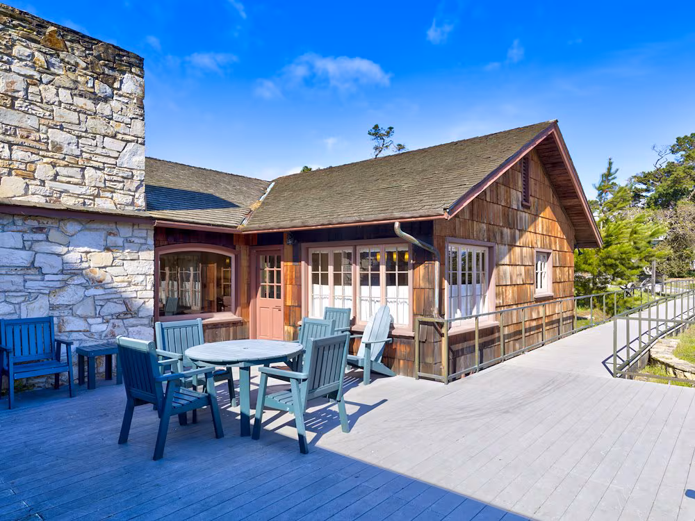 rustic-cabin-with-a-stone-chimney-on-a-sunny-day-asilomar-hotel-and-conference-grounds-pacific-grov...